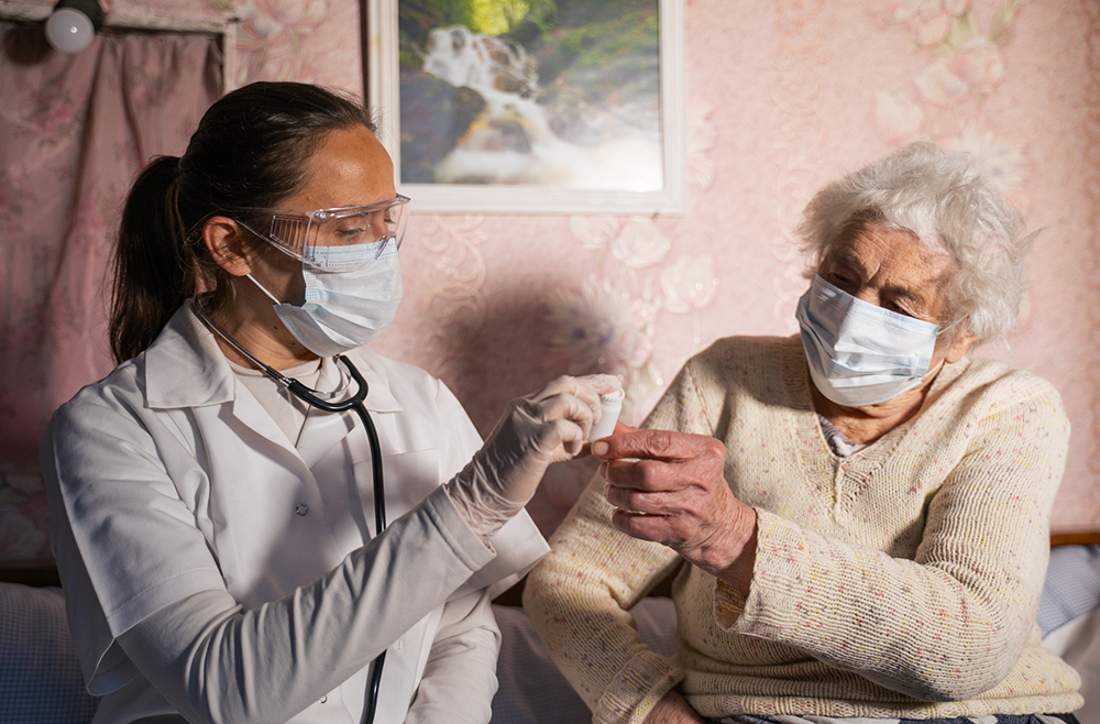 Visiting Nurse with Patient in home
